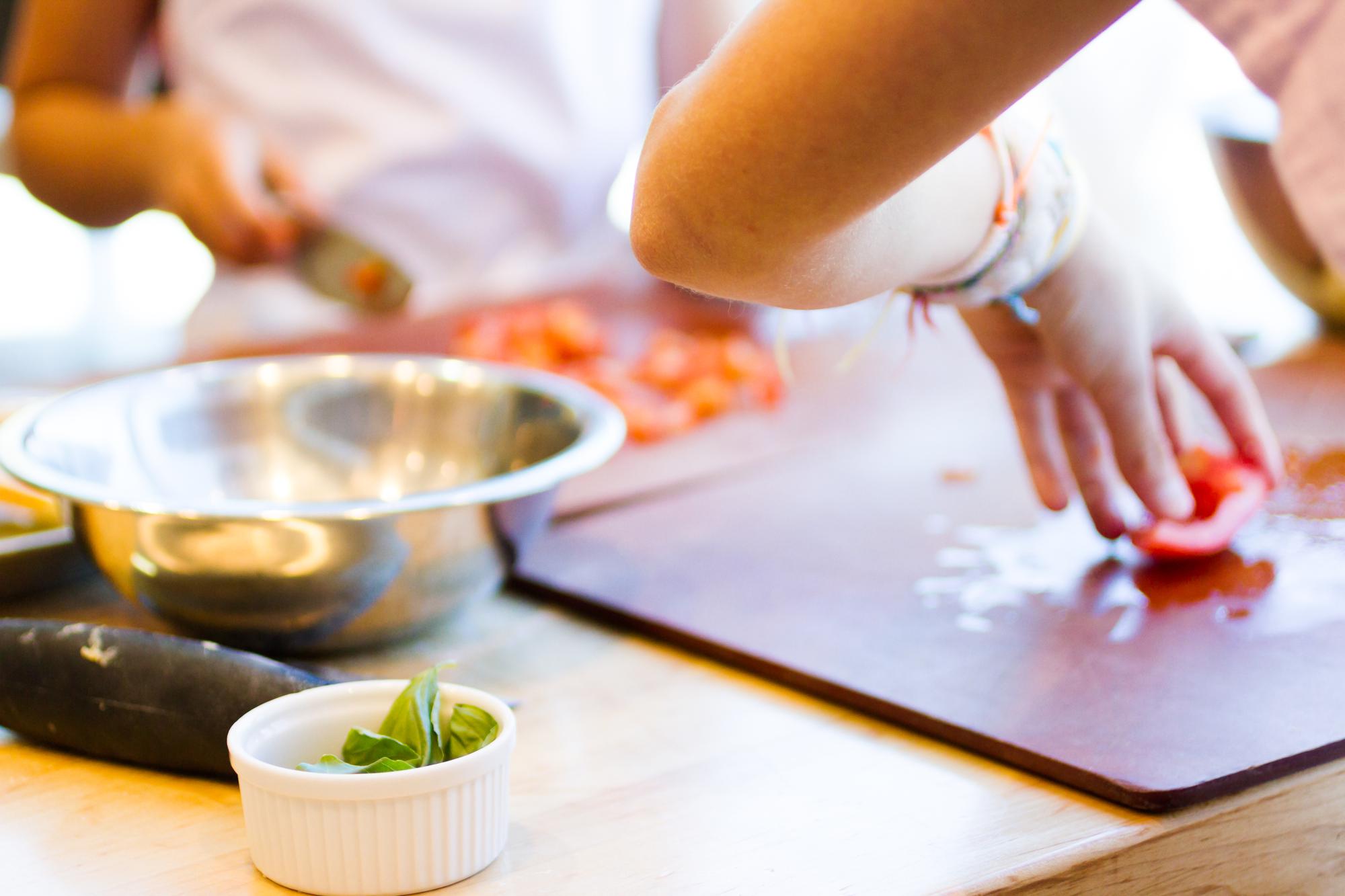 Close-up of sous-chef using precise tools